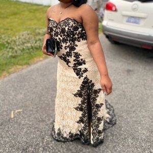 Crème prom dress with black embellishments